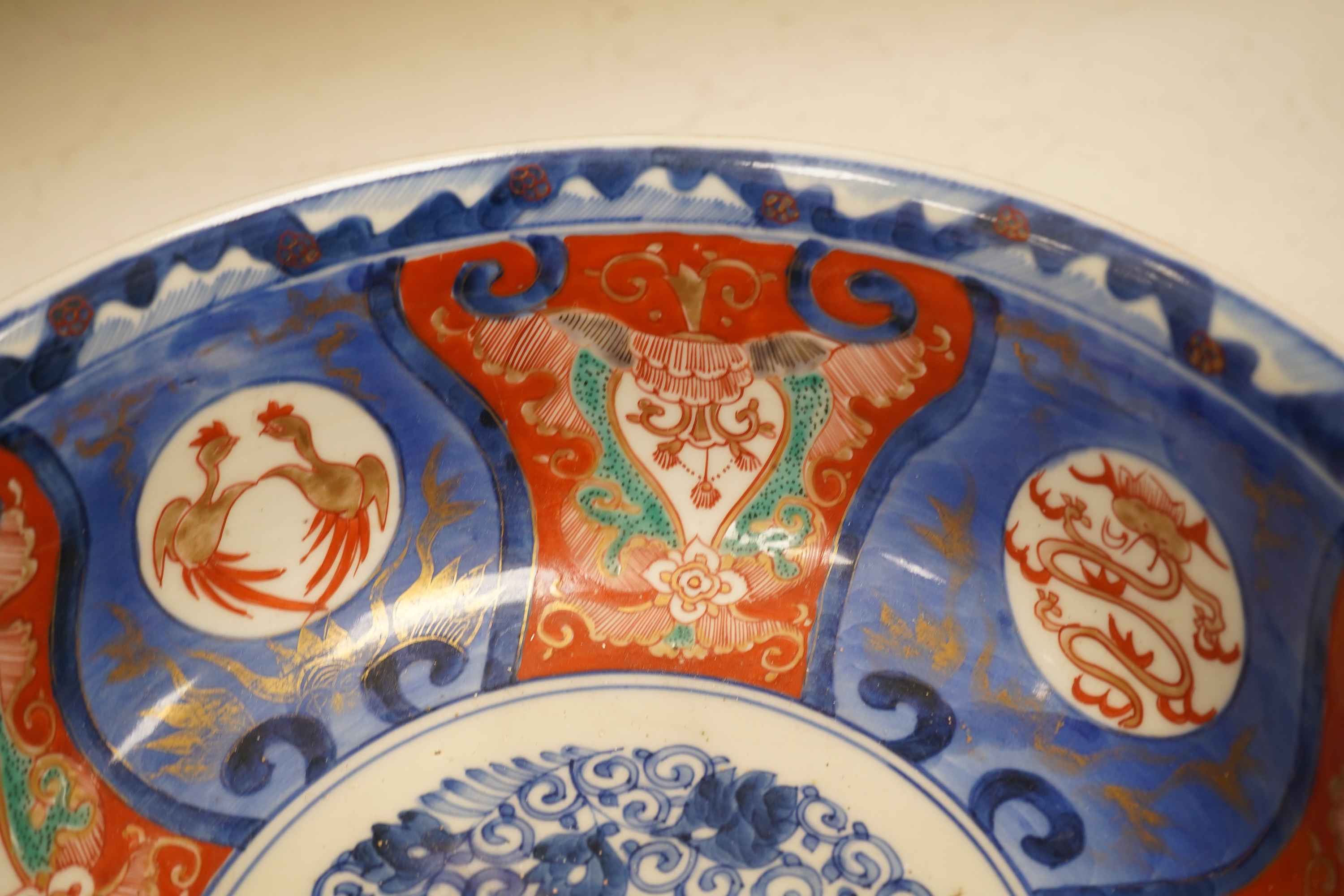 A Japanese Imari bowl and a similar fluted dish, bowl 25cm diameter